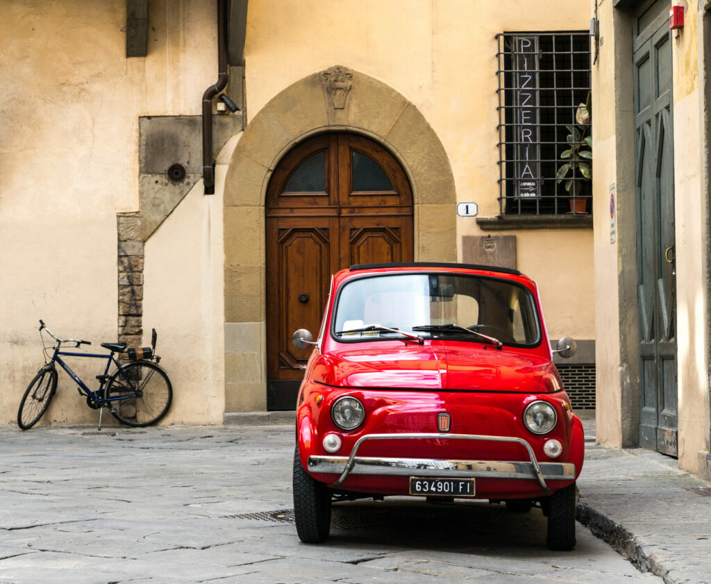 Florence, Italy - April 25, 2016: Vintage Fiat 500L parked on quite street in the old town of Florence.
